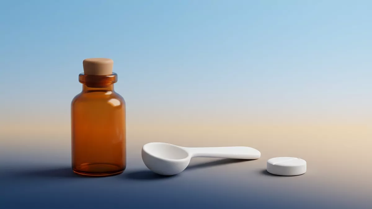 Abilify şurup ve tablet formlarını temsil eden, ölçek kaşığıyla duran amber renkli ilaç şişesi ve beyaz tablet.